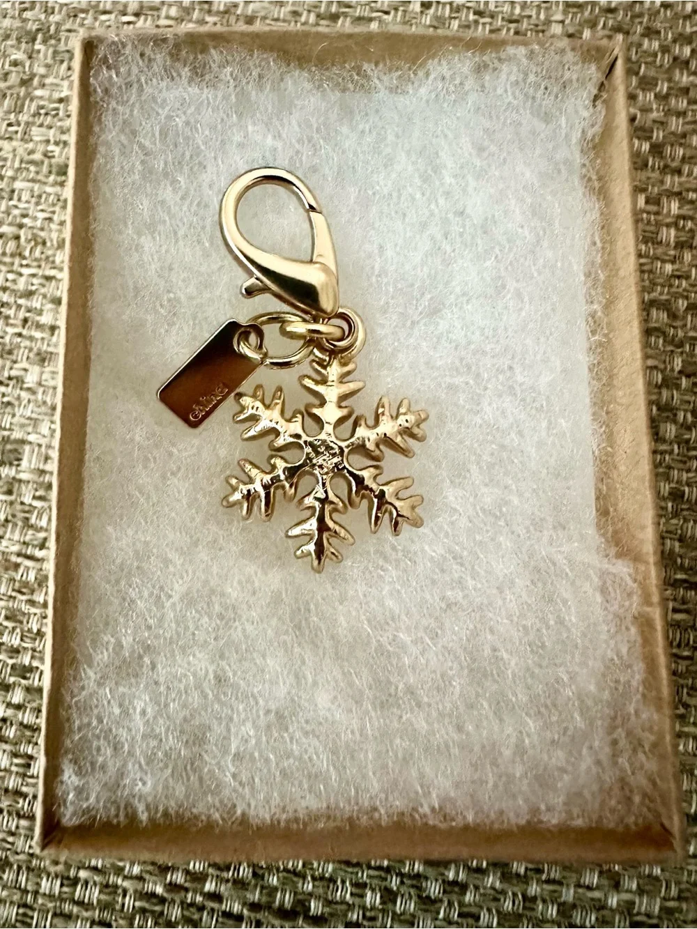 Coach Gold-Tone Snowflake Bag Charm with Logo Branded Tag - Collectible Gift